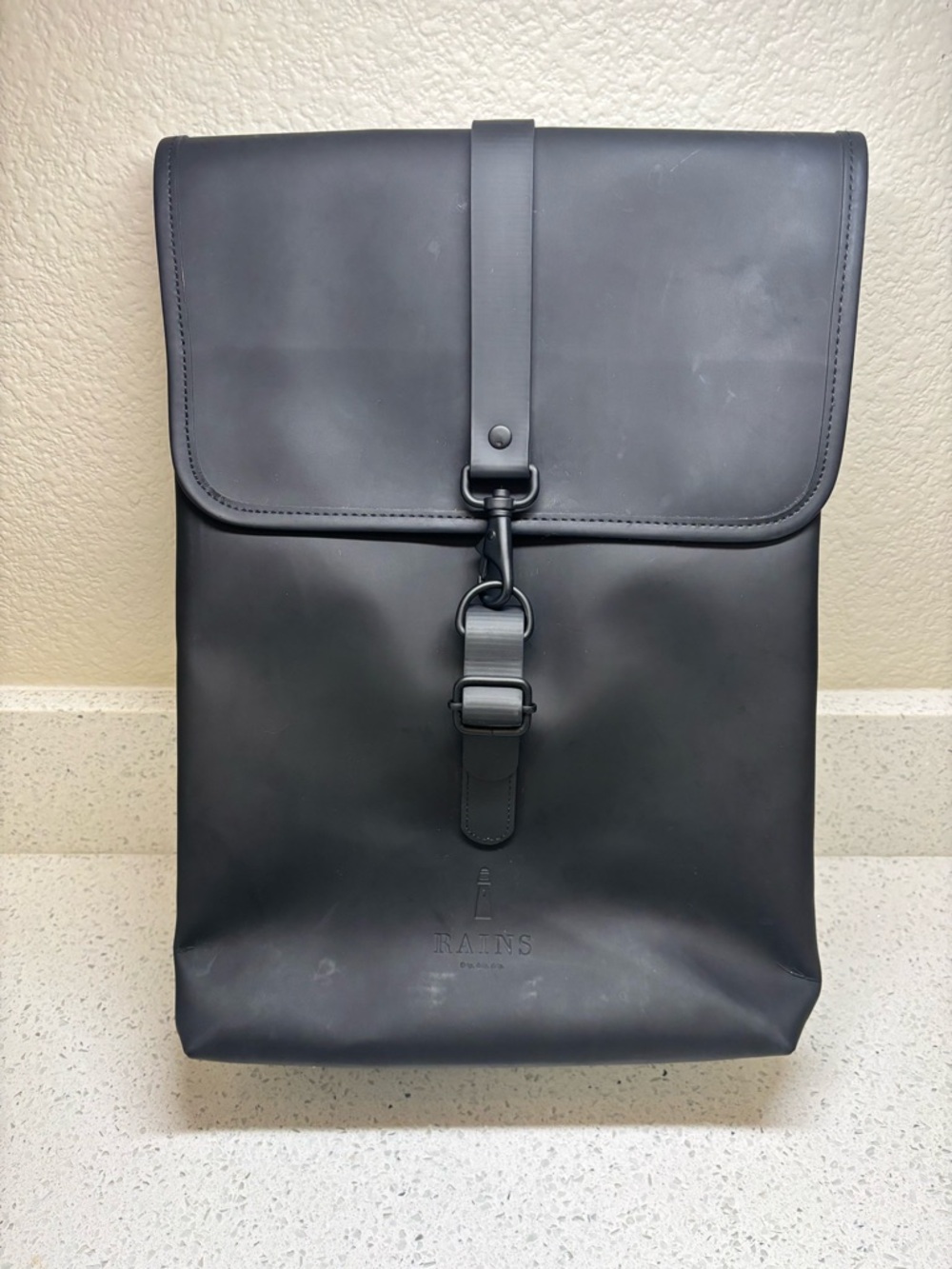 Rains Black Minimalist Roll-Top Backpack with Front Buckle